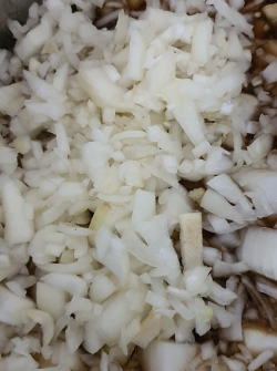 Picture of brown onions, roughly chopped.